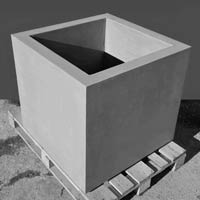 Flowerpot made of gray exposed concrete